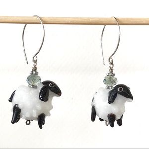 Lamp work glass sheep bead earrings.